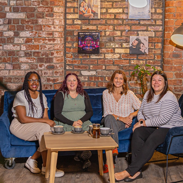 Photo of Team HR sat on Sofa